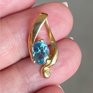 14K solid gold blue topaz pendant.
